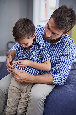 Buy stock photo Cropped shot of a handsome young man and his son getting dressed in the morning