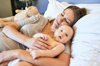 Buy stock photo Shot of a young mother and her baby at home