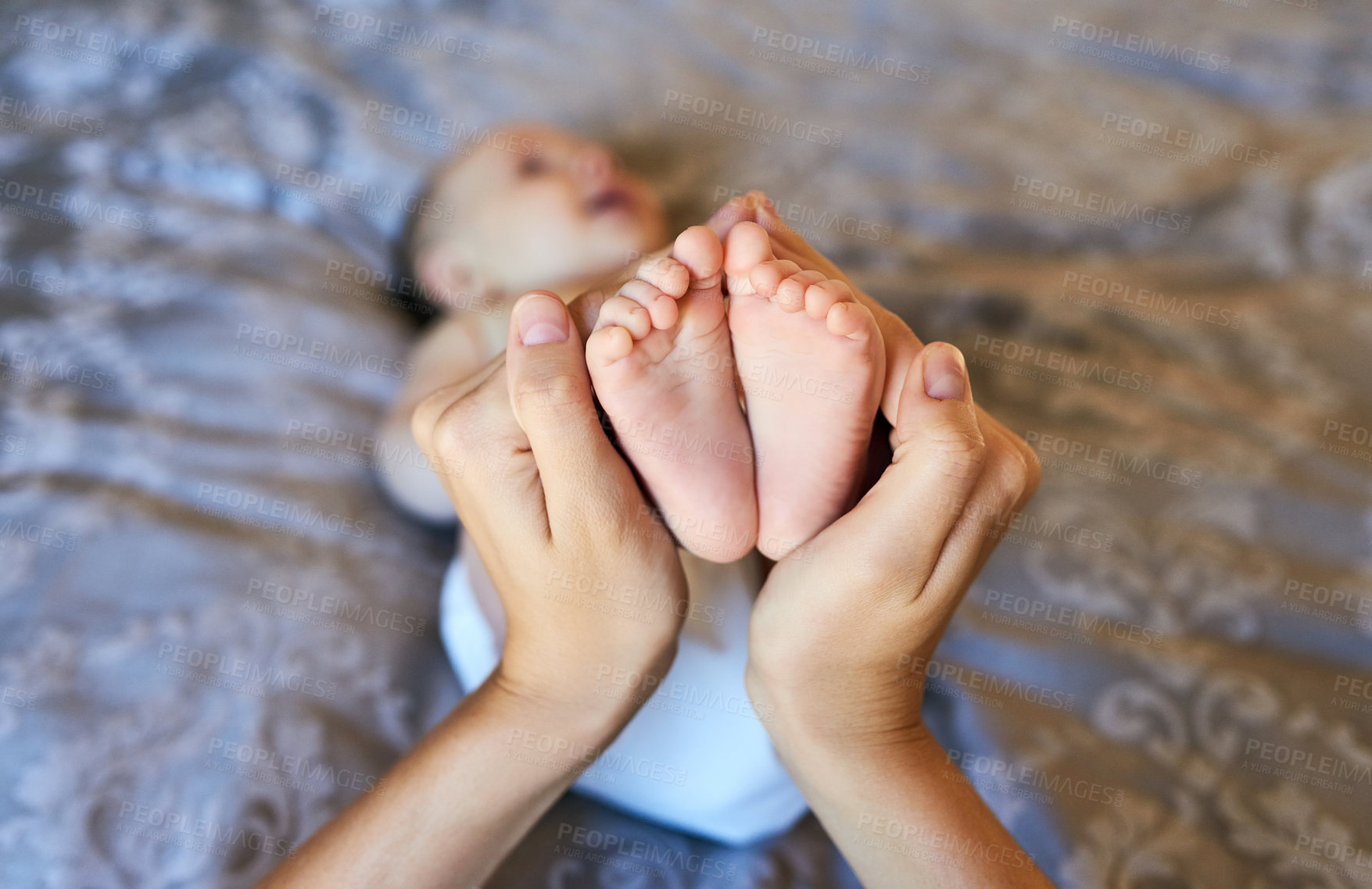 Buy stock photo Mother, hands and baby feet in bedroom with family bonding for care, security and emotional comfort of nurture. Person, infant and foot for gentle touch, connection and growth development at house