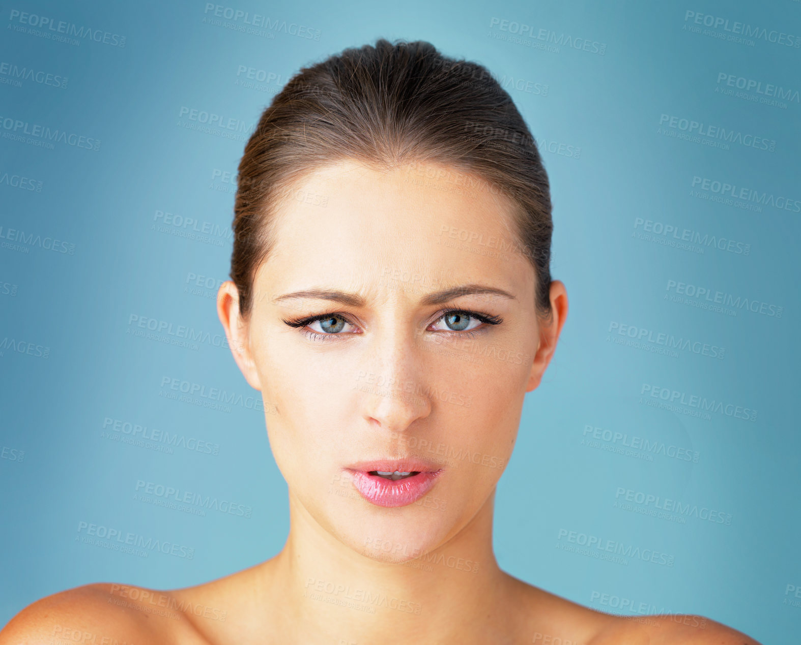 Buy stock photo Woman, cosmetics and unhappy in portrait, studio or frowning in expression for healthy skin in blue background. Female person, results and face for skincare, pride or glow for dermatology or wellness