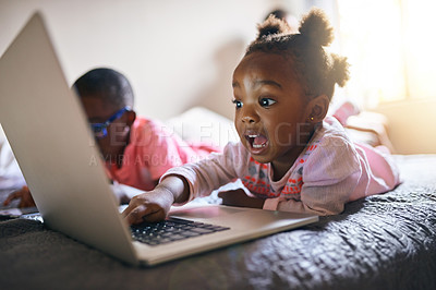 Buy stock photo Girl child, online and bedroom with laptop in home for creative activity, learning and streaming movies. Toddler, internet and technology for curiosity or engaging for education growth or development