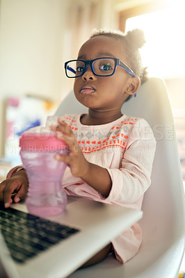 Buy stock photo Girl kid, portrait and relax with laptop in home for creative activity, learning and streaming movies. Toddler, internet and technology for curiosity or engaging for education growth or development.