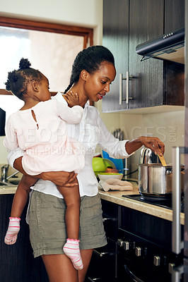 Buy stock photo Black family, mother and cooking with baby in kitchen for food, meal or lunch together at home. African mom, young child or hungry kid with pot on stove for dinner, snack or preparation at house