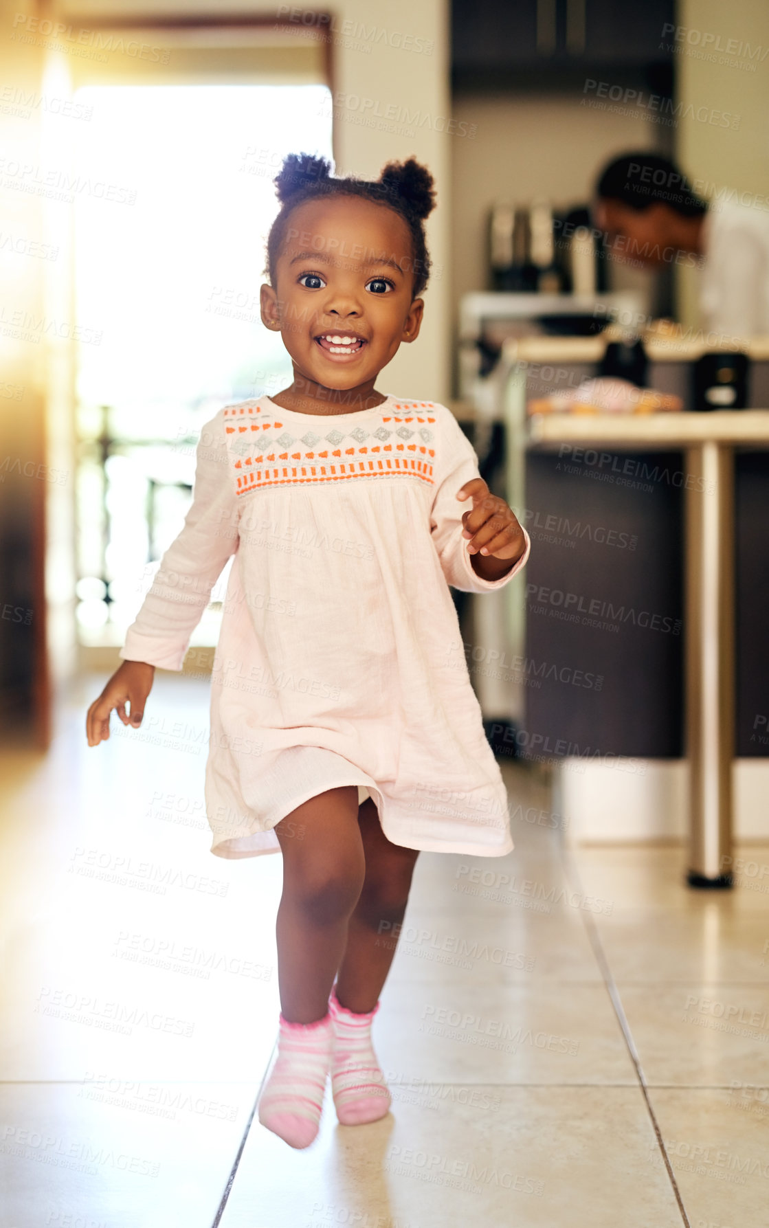 Buy stock photo Black girl, child and walking in home, portrait and toddler skills or motor development in kitchen. Female person, mother cooking and happy kid for growth in childhood, practice movement and daughter