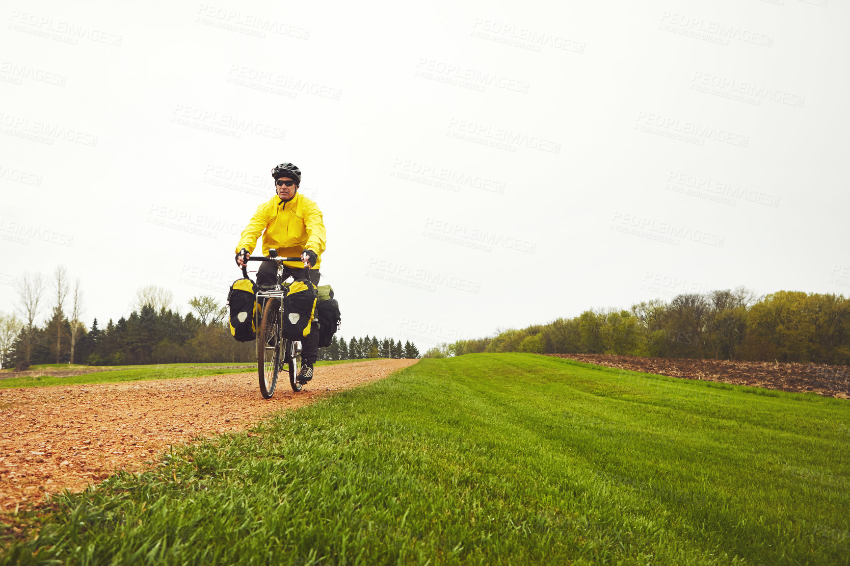 Buy stock photo Outdoor, sports and man on bicycle in nature for exercise, training or practice for active hobby. Space, fitness and person on bike for cycling, workout and endurance in winter for wellness or health