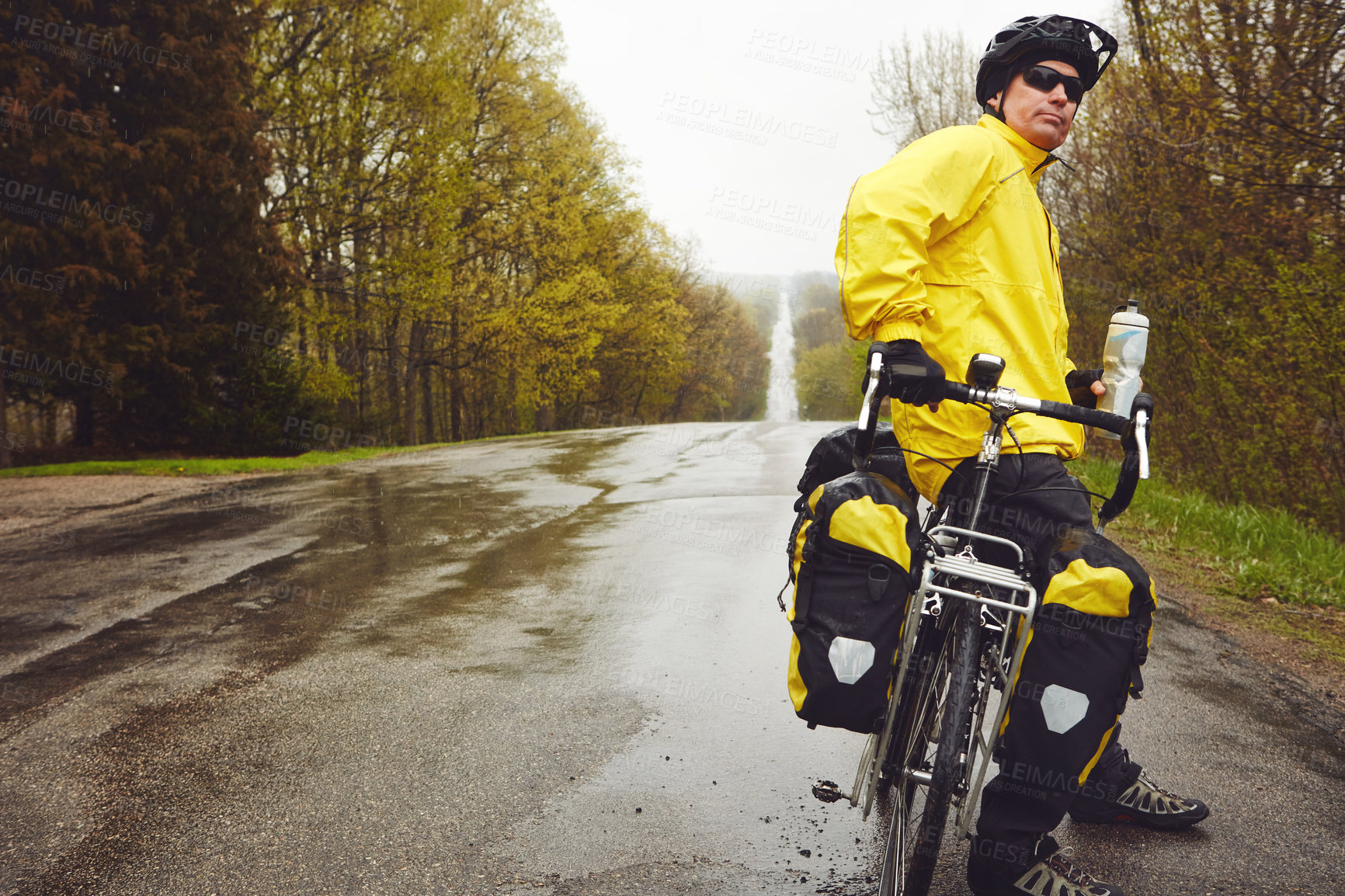 Buy stock photo Travel, man and rest with touring bicycle in nature for bikepacking, winter adventure and freedom. Cyclist, mature person and relax with bike on wet road for cycling journey, water break or exploring