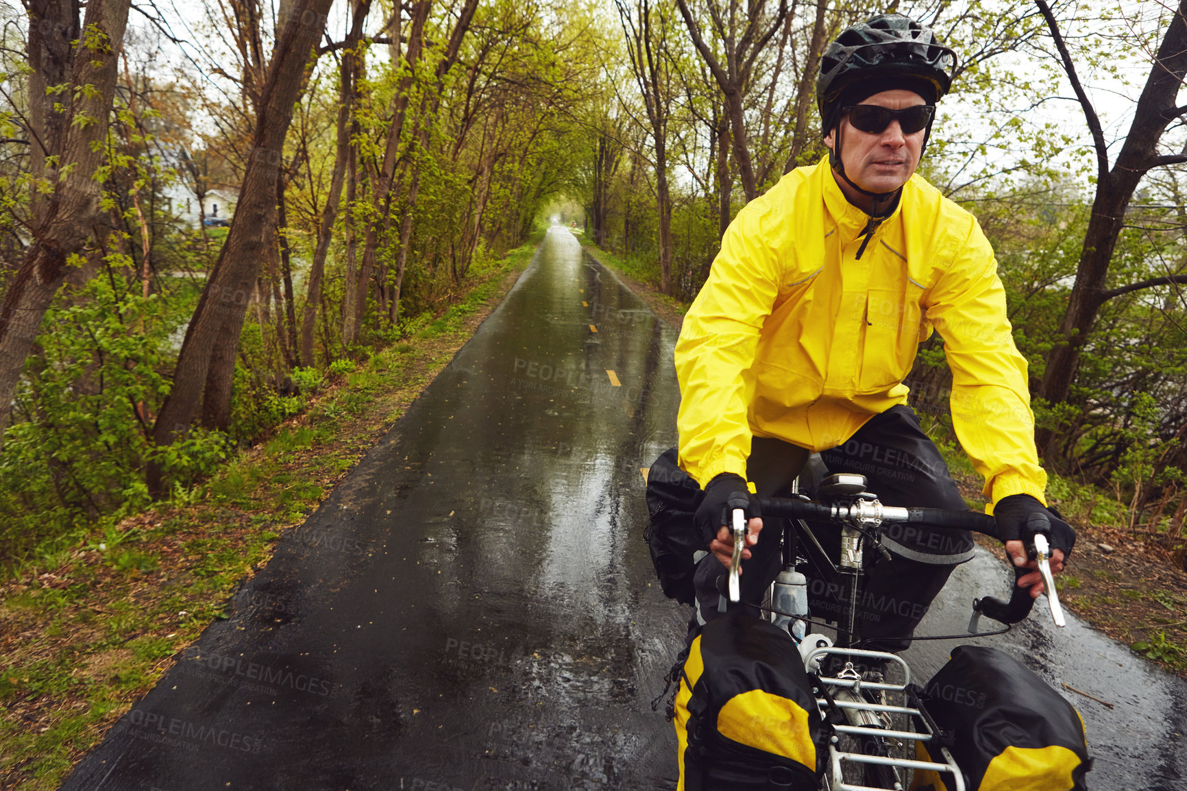 Buy stock photo Outdoor, cycling and man with bicycle, forest and adventure with raincoat, serious or ride in nature. Cyclist, journey and mature person with eco friendly transport, winter holiday and travel on bike