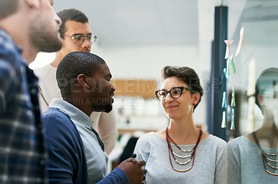 Buy stock photo Office, people and happy on glass wall for strategy with teamwork, collaboration and planning. Brainstorming, ideas and vision or mission for project at workplace with sticky notes for solution