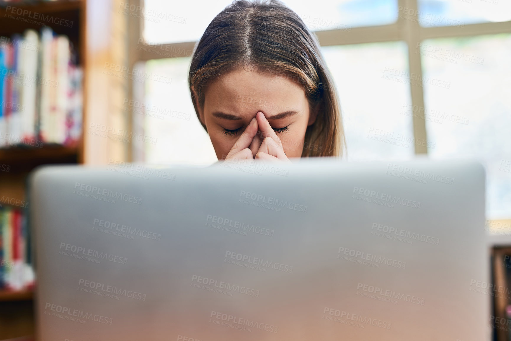 Buy stock photo Stress, thinking and woman with laptop in library at university for education, online course or study. Computer, fatigue and college student with anxiety, brain fog and burnout with research project