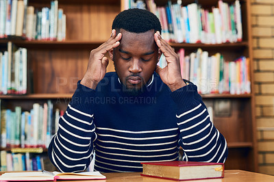 Buy stock photo Cropped shot of a university student looking stressed while sitting in the library