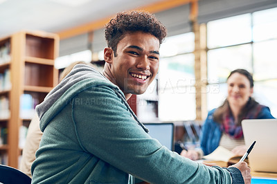 Buy stock photo Portrait of a university student sitting in the library