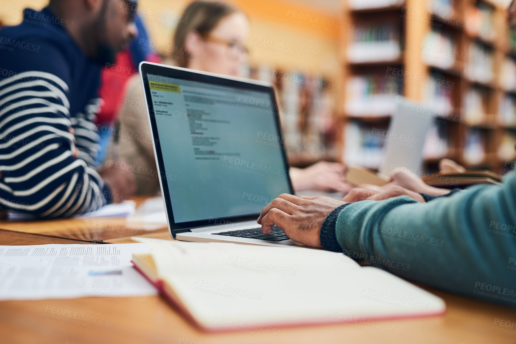 Buy stock photo Education, university and student on laptop in library for learning, knowledge and research. School, college and hands of person with computer, books and friends for project, studying or assignment