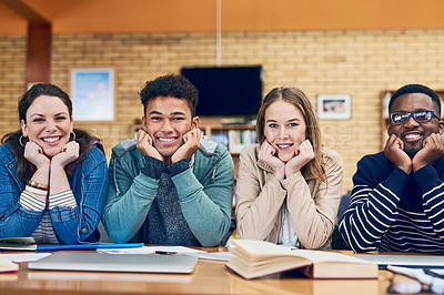 Buy stock photo Portrait of a group of university students sitting together in a library