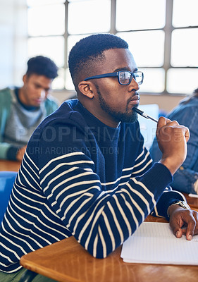 Buy stock photo Cropped shot of a university student sitting in class