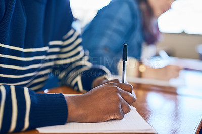 Buy stock photo Cropped shot of a university student writing exams
