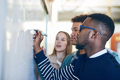 Buy stock photo Diversity, students writing on whiteboard and in classroom of school building. Problem solving or formula, brainstorming or presentation and people write on board in class of college or university 