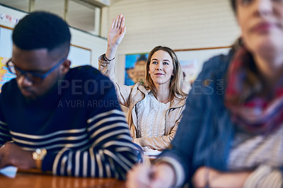 Buy stock photo Shot of a young woman raising her hand in class
