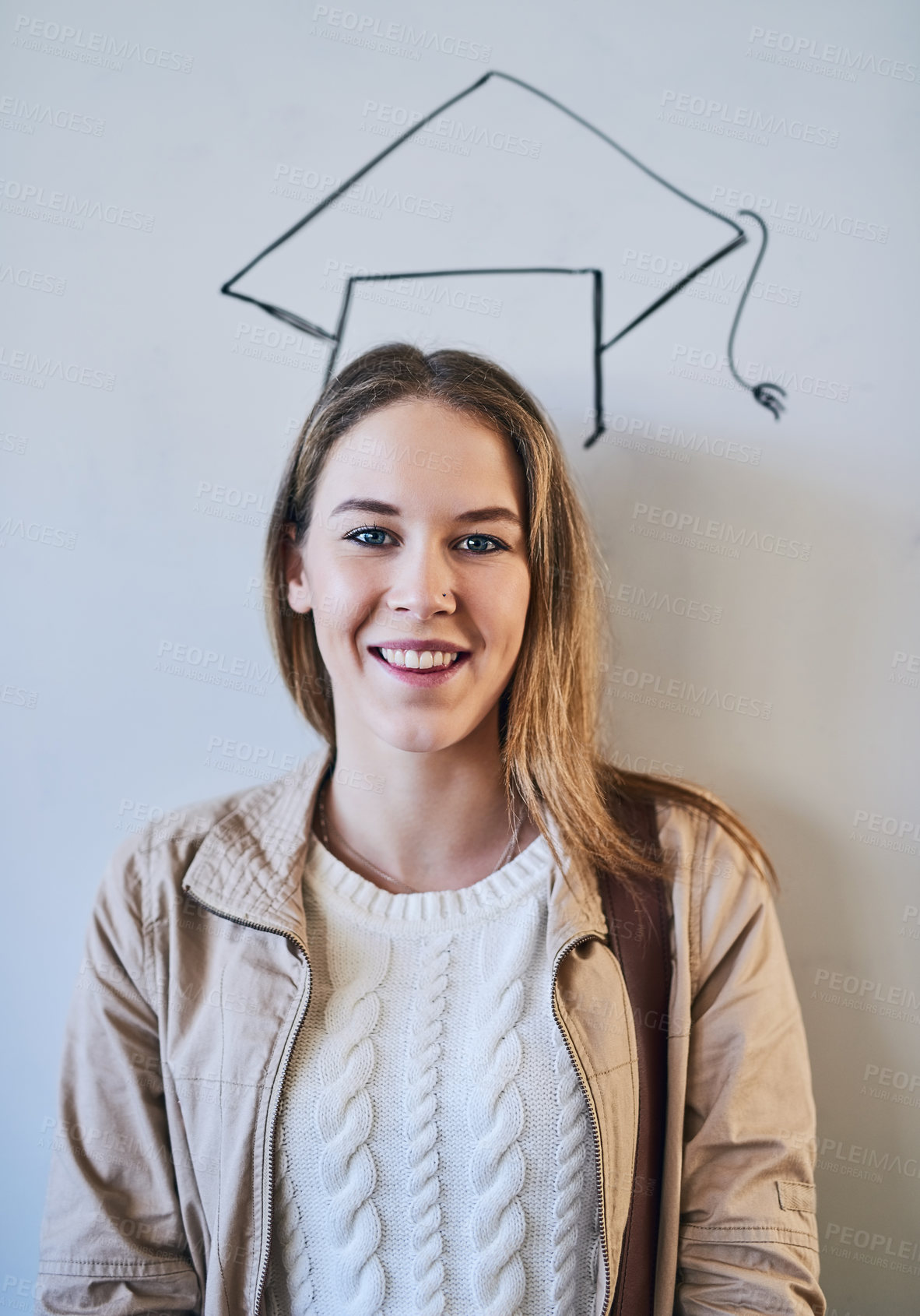 Buy stock photo Woman, student and drawing of graduation cap on board with smile, pride or bag for education at college. Girl, person and happy for sketch, portrait and learning in classroom at university in Germany