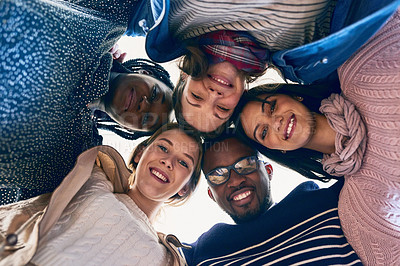 Buy stock photo Cropped shot of a group of university students looking down at the camera