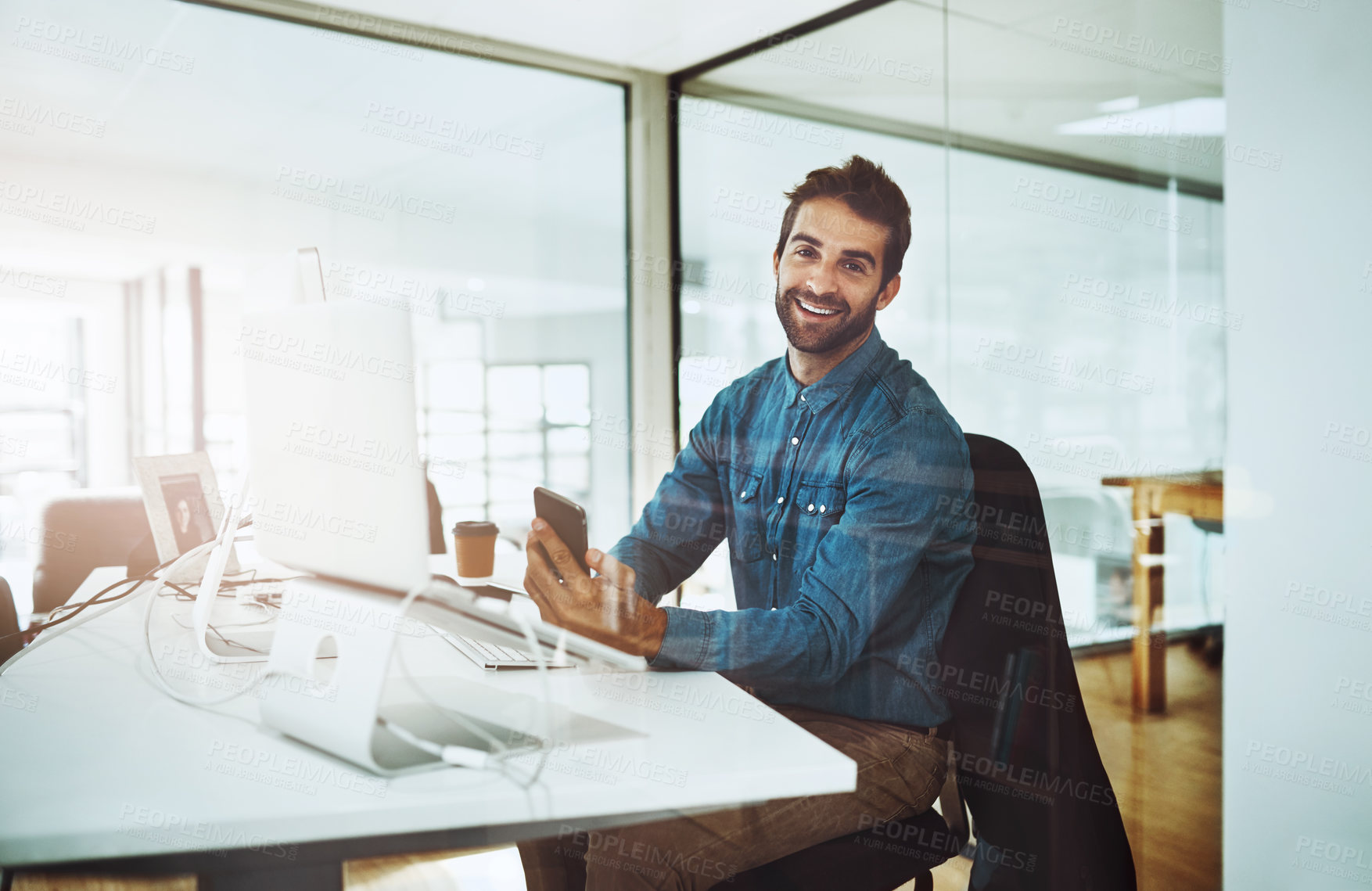 Buy stock photo Portrait, laptop and businessman with smartphone in office for networking, text or talk with contacts. Career, journalist or male person with phone to connect, chat or message source for information