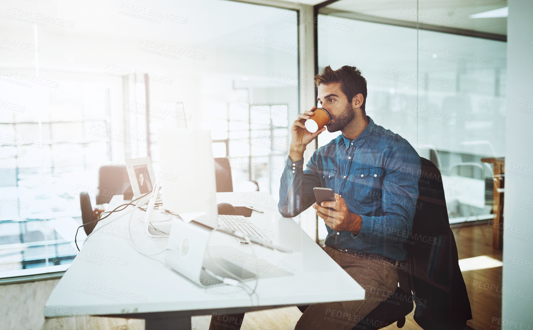 Buy stock photo Businessman, coffee and cellphone at desk in office for networking communication and relax at work. Technology, male person and web development in workspace for online research and marketing company