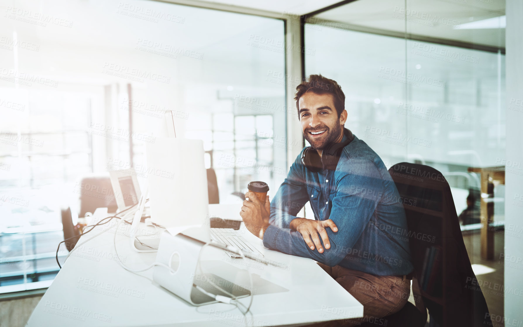 Buy stock photo Man, technology and office portrait with coffee, lens flare and startup business. Morning light, entrepreneur face and creative job by desk with computer, reading email and online work for web design