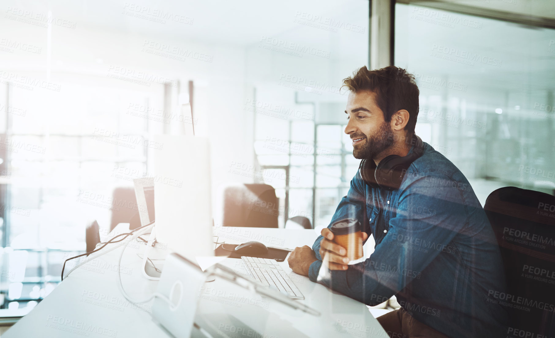 Buy stock photo Computer, flare and research with business man at desk in office for online project management. Internet, planning and report with happy young employee at table in workplace for administration