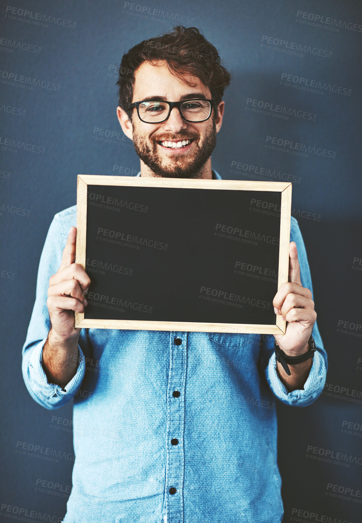 Buy stock photo Glasses, portrait and man with chalkboard for mockup space with marketing, promotion or advertising. Happy, career and male teacher from Canada with sign for education isolated by studio background.