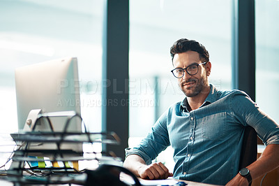 Buy stock photo Business man, portrait and working at computer, office desk or confidence for web development in IT company. Young software developer at desktop in professional startup with pride, glasses and agency