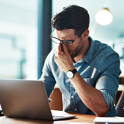 Buy stock photo Stress, pain and eye strain from long hours working on the laptop causing headache, bad sight and vision problem. Burnout, tired and overworked young businessman removing glasses to rub dry eyes