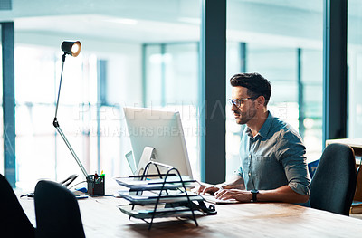 Buy stock photo Business man, computer and focused in office for planning strategy, online research and typing at desk. Worker, desktop and website connection for digital project, internet software or admin analysis