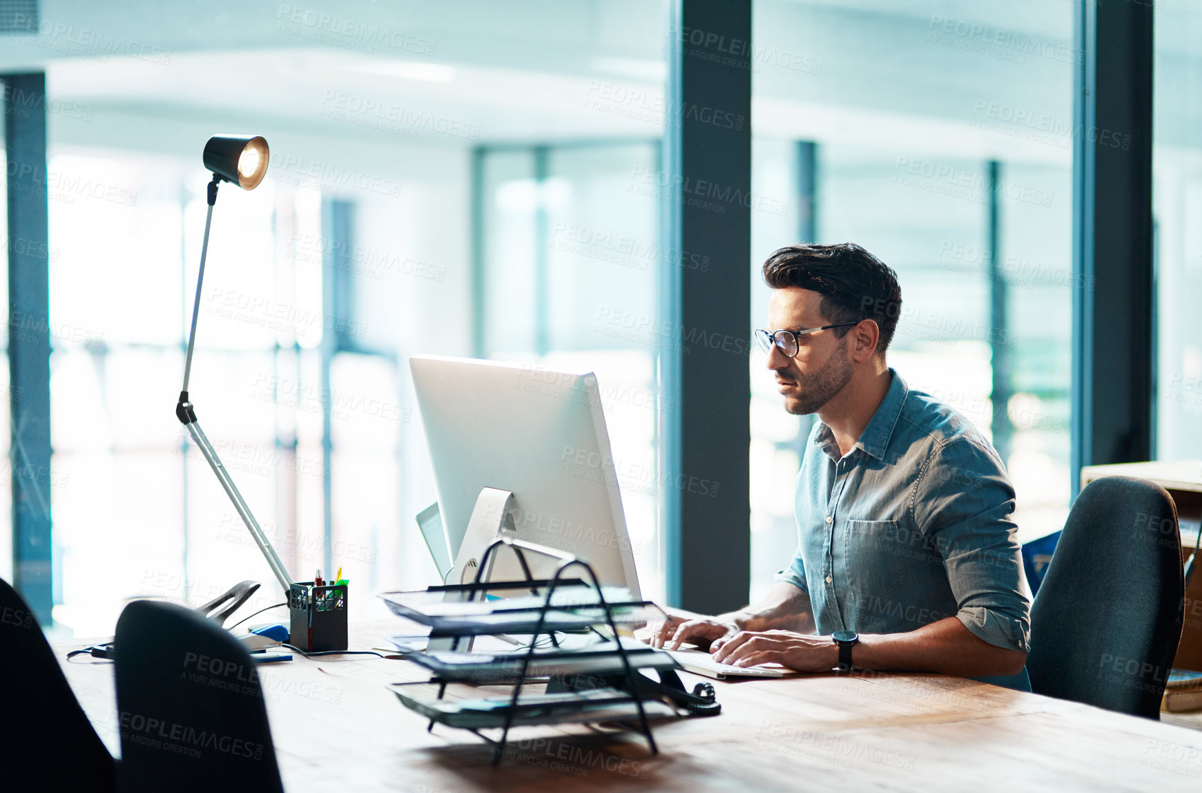 Buy stock photo Business man, computer and focused in office for planning strategy, online research and typing at desk. Worker, desktop and website connection for digital project, internet software or admin analysis