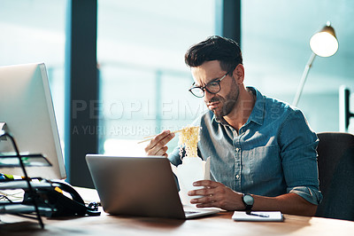 Buy stock photo Unhappy business man eating noodles in office at laptop in startup agency with disgust, upset or problem. Frustrated, sad and angry male employee with bad fast food at computer for working in company