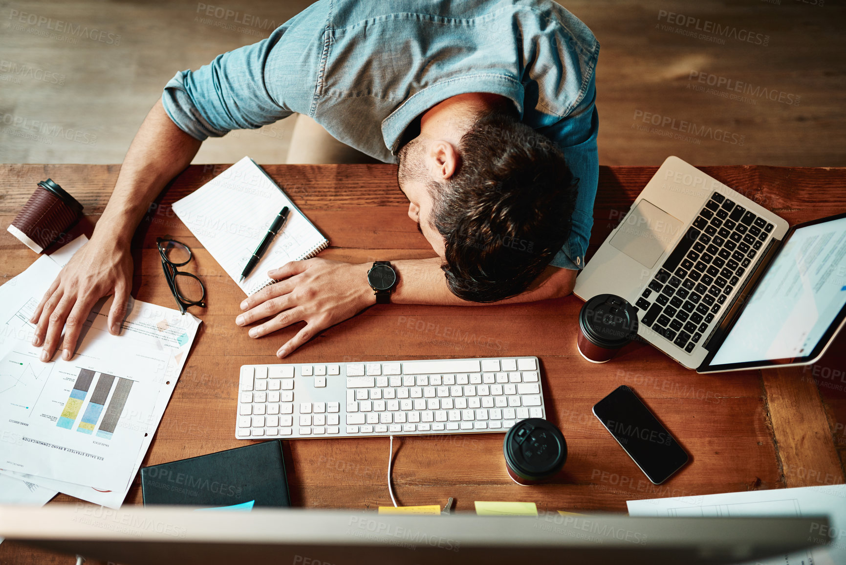 Buy stock photo Top view, tired man and sleeping at desk in office with burnout, bored and stress. Fatigue, lazy and overworked business employee taking nap at table for frustrated deadline, depression or low energy