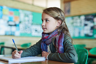Buy stock photo Shot of an elementary school girl working in class