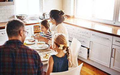 Buy stock photo Family, morning and breakfast by table in kitchen for meal, eating or bonding time together at home. Mother, father and children with healthy food to start the day for nutrition or cereal in house
