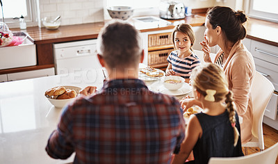 Buy stock photo Happy family, morning and breakfast on kitchen table for meal, eating or bonding time together at home. Mother, father and children with healthy food to start the day for nutrition or cereal in house