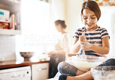 Buy stock photo Messy, happy and child baking in the kitchen with parent for bonding, food and dessert. Funny young girl mixing flour in a bowl with chaos, energy or cooking with happiness while playing for learning
