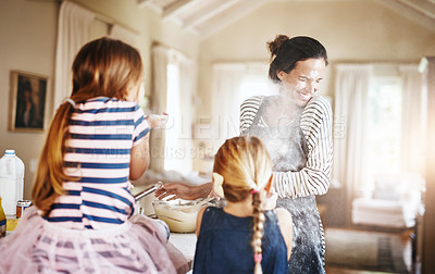 Buy stock photo Mom, playing or kids baking with flour in messy kitchen with children siblings laughing together at home. Smile, family or happy parent cooking or teaching fun daughters to bake for child development
