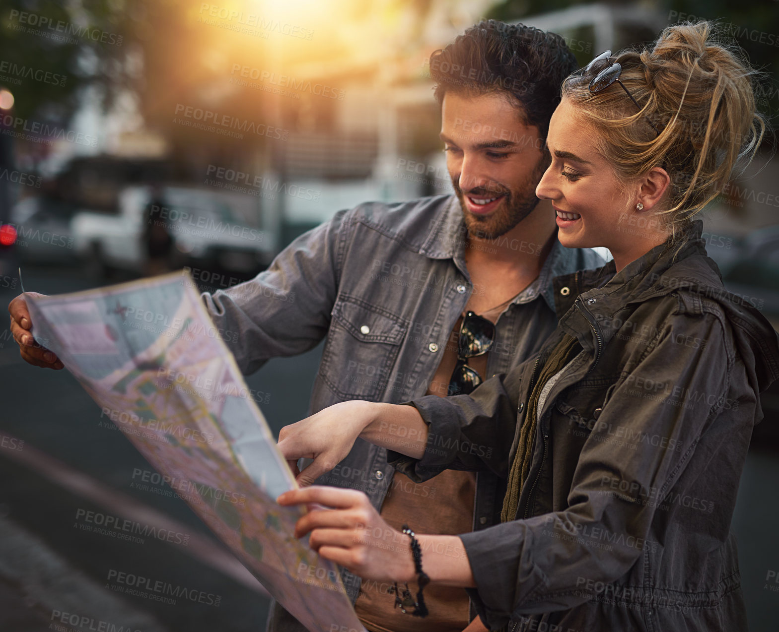 Buy stock photo City, couple and map for reading, search and location navigation in evening in London. Dating people, man and woman with paper for guidance, hotel direction and instructions for vacation together