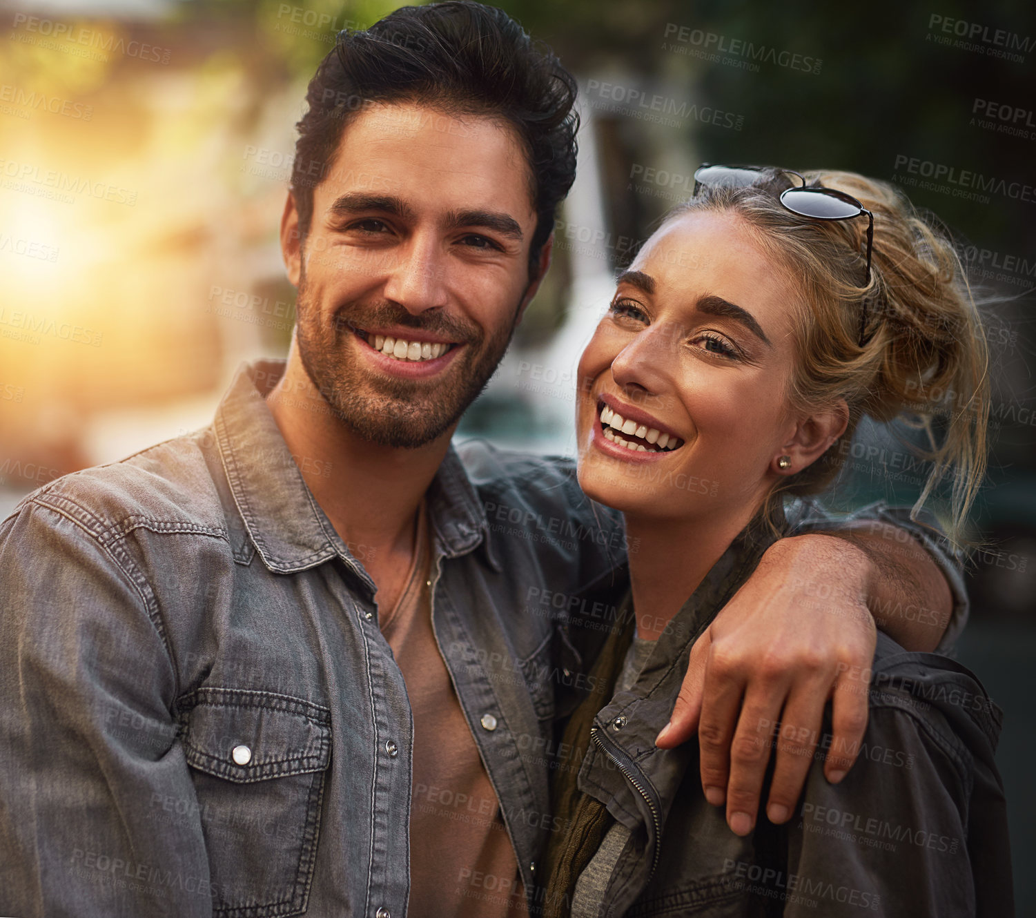 Buy stock photo Love, hug and portrait of happy couple in a park form sunset, date and bonding in nature together. Romantic, travel and people embrace in a forest for anniversary, celebration and journey in London