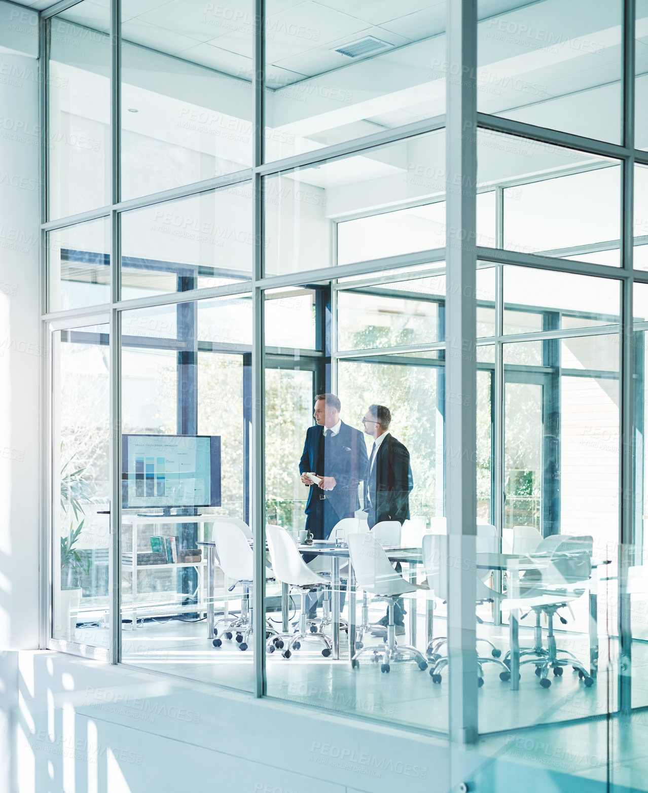 Buy stock photo Full length shot of two corporate businessmen meeting in the boardroom