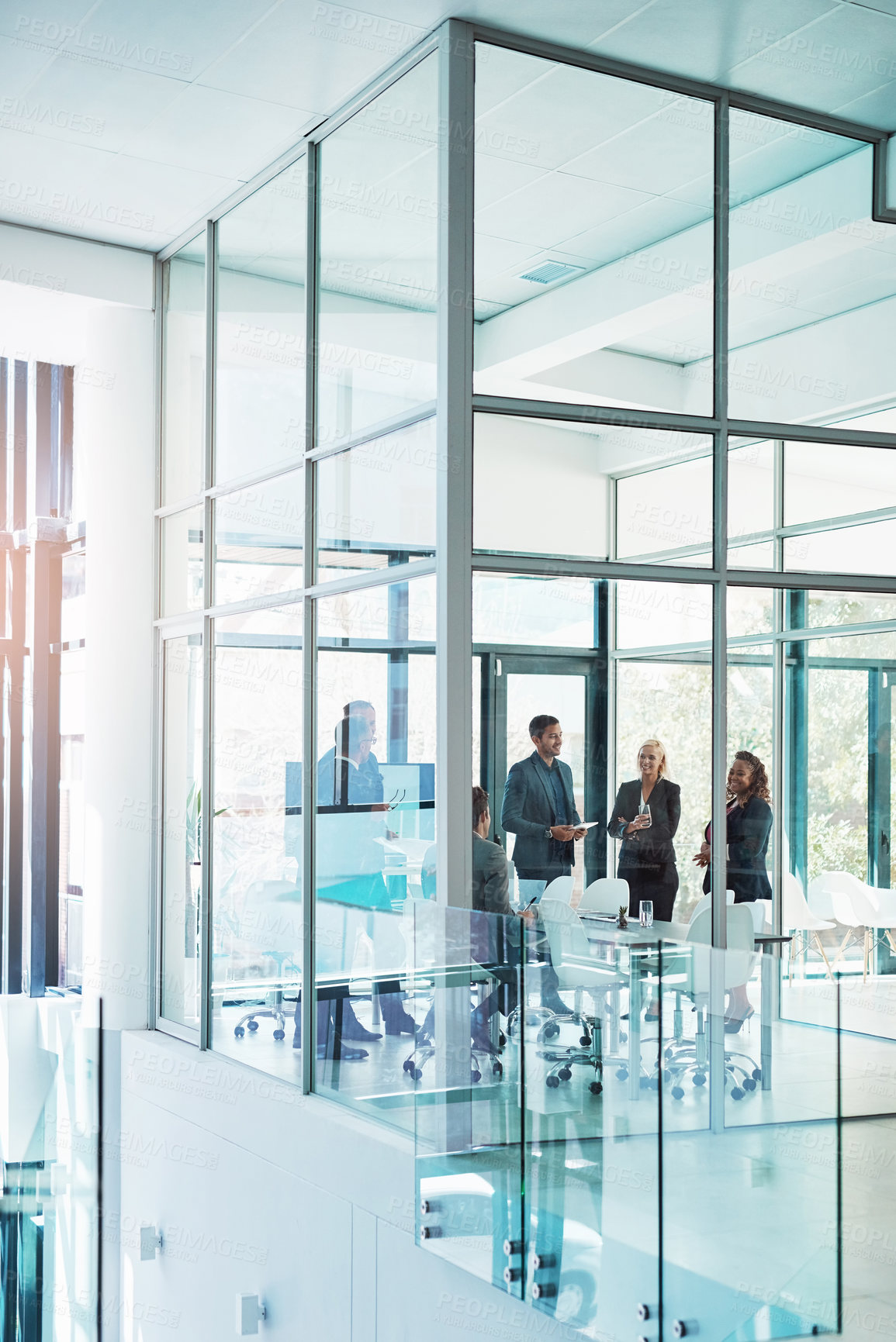 Buy stock photo Full length shot of a group of corporate businesspeople meeting in the boardroom