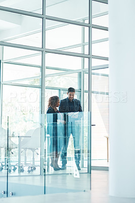 Buy stock photo Full length shot of two corporate businesspeople talking before their meeting in the boardroom