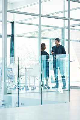 Buy stock photo Full length shot of two corporate businesspeople talking before their meeting in the boardroom