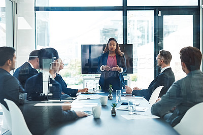 Buy stock photo Cropped shot of an attractive young businesswoman giving a presentation in the boardroom