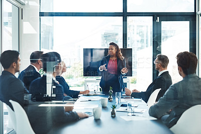 Buy stock photo Cropped shot of an attractive young businesswoman giving a presentation in the boardroom