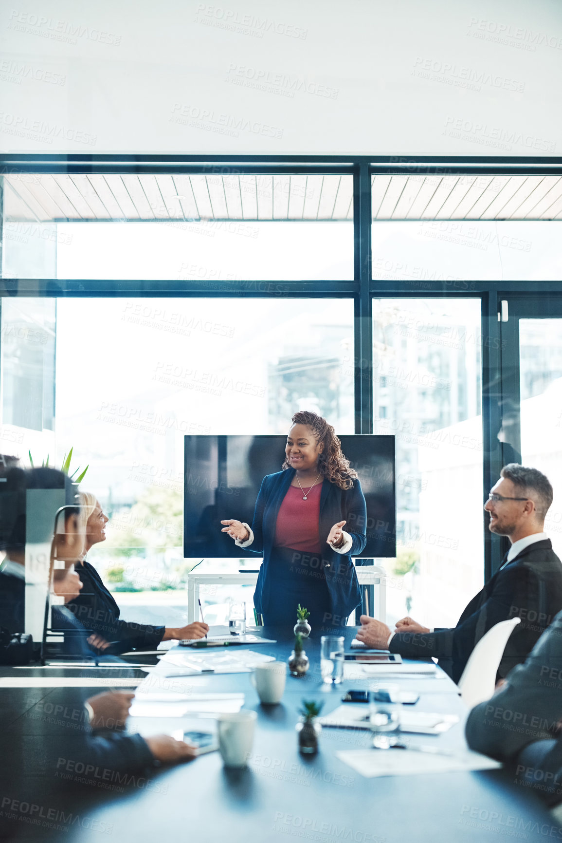 Buy stock photo Cropped shot of an attractive young businesswoman giving a presentation in the boardroom