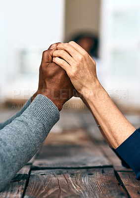 Buy stock photo Cropped shot of two unrecognizable people holding hands