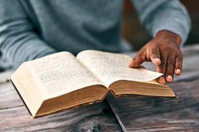 Buy stock photo Cropped shot of an unrecognizable man reading a book